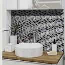 Paris mosaic being used as a splashback behind a bathroom sink. The mosaic is a monochromatic colour sheme