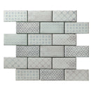 Brick shaped mosaic on a white background featuring different subtle floral pattern deisgns