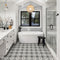 Lifestyle image of a bathroom, with a bath under a window showing the Floral Classic tile on the floor