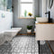 Lifestyle image showing a bathroom with a sink and cabinet, with the Diamond Tile on the floor showing the white, grey and black overall finished design