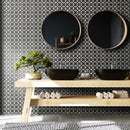 Lifestyle image of the Floral Eclipse tile showing the floral tile being used as a feature wall in a bathroom, with two mirrors and two sinks