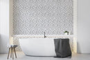 Moderne Carrera lifestyle image showing the mosaic being used as a statement wall behind a bath in the bathroom