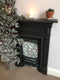 Geo Moroccan Bright Self Adhesive being used to add a splash of colour to a dark fire place