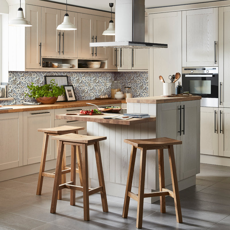 Lisbon Mosaic Tile lifestyle image, showing the tile as a backsplash in a wood, neutral toned kitchen