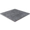 Bluestone Dark Grey Outdoor Porcelain tile shown from the side, which shows the 20mm thickness of the tile