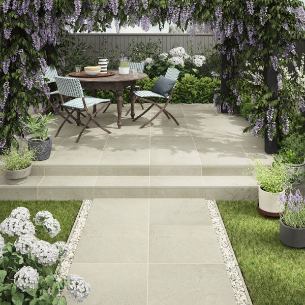 Sandstone Outdoor Porcelain Tile showing the beige coloured tile being used in a garden with steps and seating area