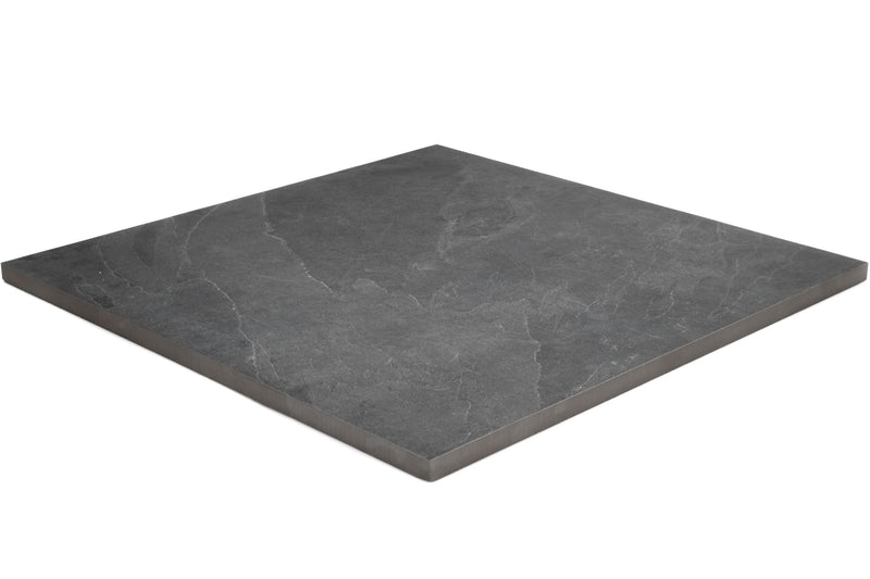 Product image of Outdoor Porcelain 600mm x 600mm x 20mm tile, in Black Slate, which is a Dark Grey / Black, stone effect tile, shown from the side