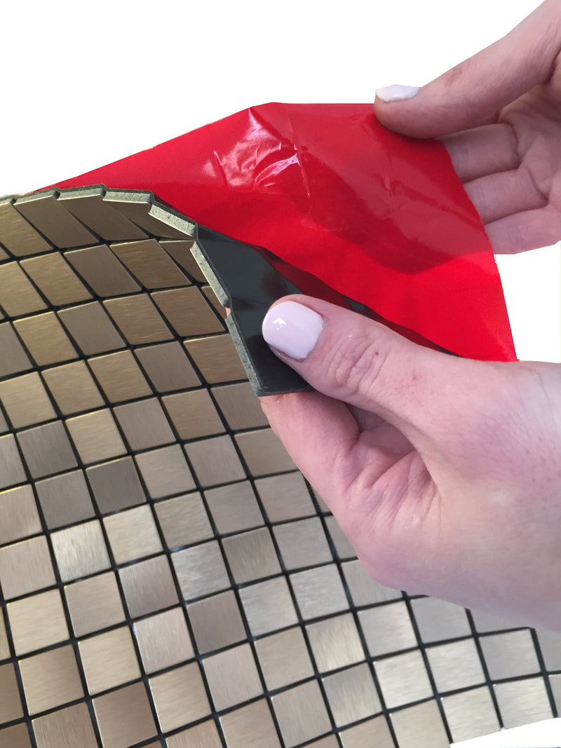 Self-Adhesive mosaic backer showing how easy it is to peel away the red film