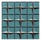The Stargazer Teal mosaic tile, with a metallic blue base that sparkles in the light. Features mirrored edging to each chip, and is square in format.