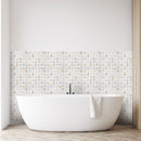 Cairo mosaic being used as a half wall feature behind a bath