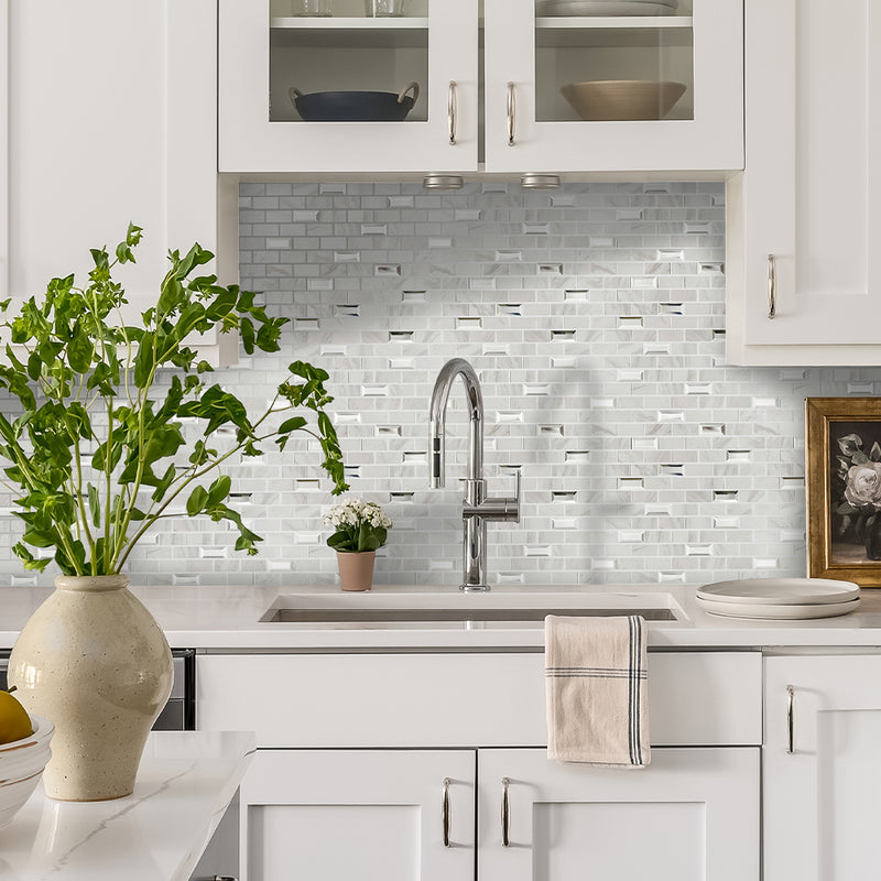 Calacatta Luxe mosaics showing the tiles being used as splashback in a clean, white kitchen