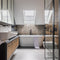 Dylan mosaic being used as to zone an area behind the bath in a bathroom