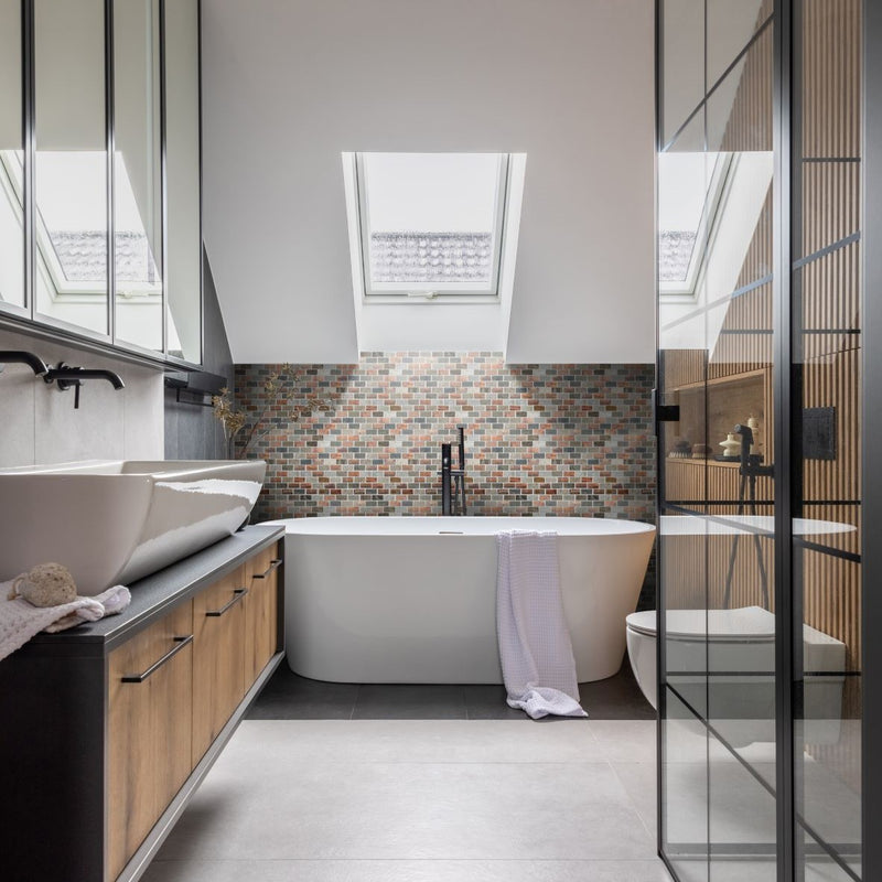 Dylan mosaic being used as to zone an area behind the bath in a bathroom