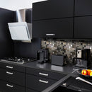 Gunmetal Luxe lifestlye image showing the mosaic being used in a black kitchen, as a splashback behind appliances