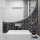 Jewel Black lifestyle image showing the black mosaic being used behind a sink with a light up round mirror