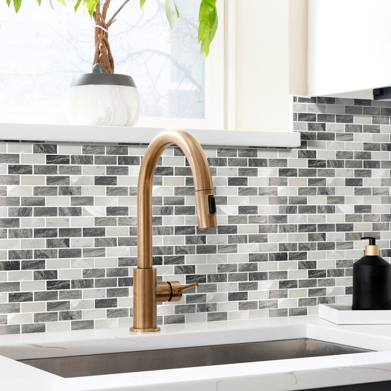 Marble Luxe lifestyle showing the grey and white mix mosaics being used as a splashback behind a sink in the kithcne