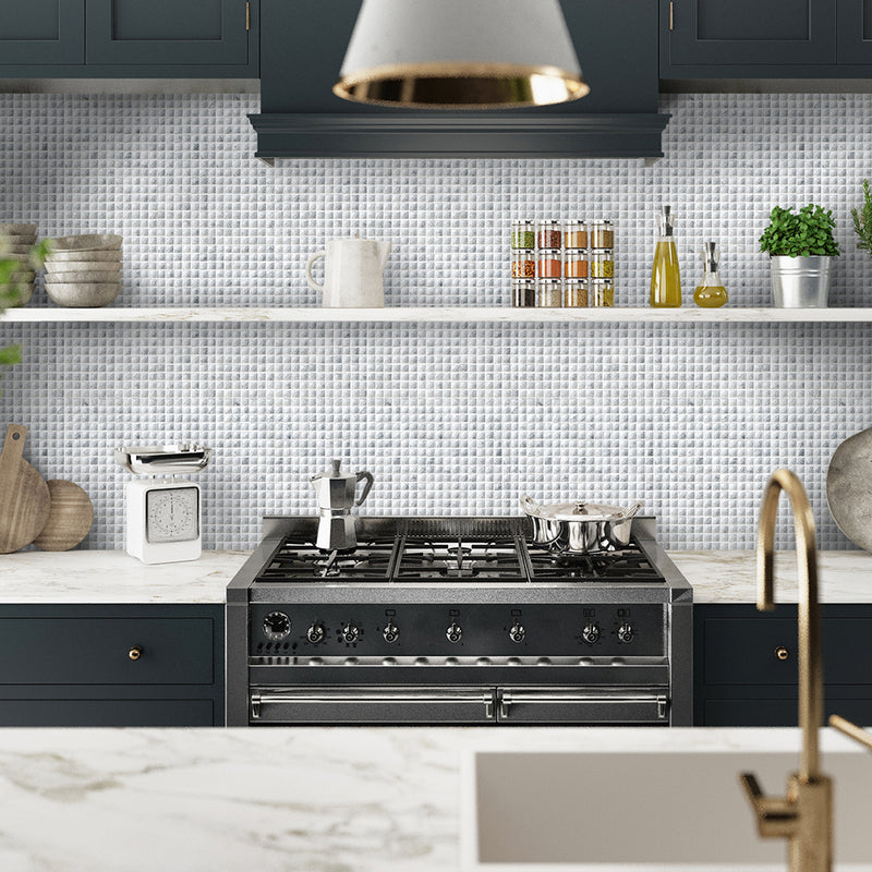 Vienna Luxe mosaics showing the white diamante effect pieces being used as a splashback in a navy blue kitchen