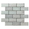 Brick shaped mosaic on a white background featuring different subtle floral pattern deisgns